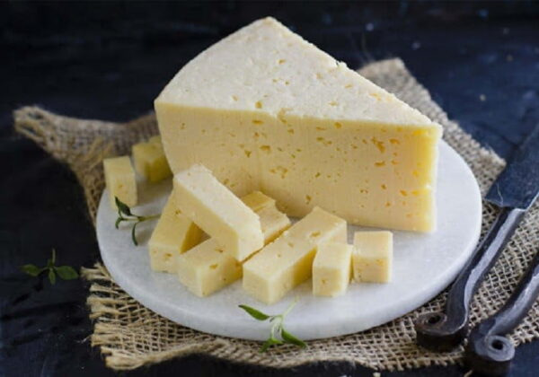 Plate with small and a big pieces of Greek batzos cheese like graviera